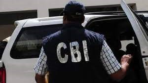 CBI agents arresting an officer in Srinagar for bribery