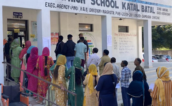 Voter casting ballot during Nagrota by-poll
